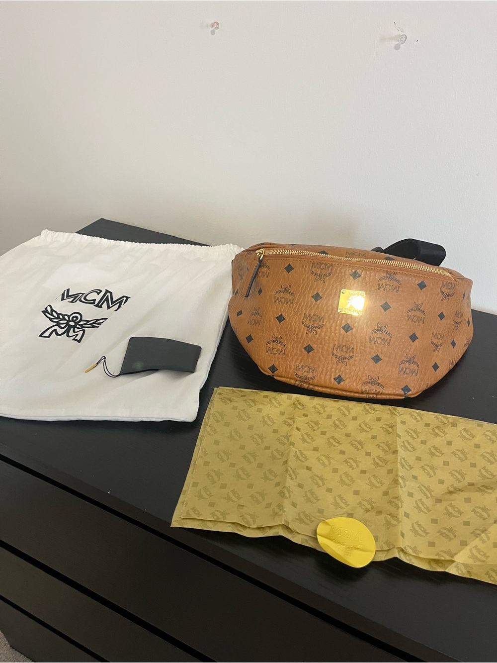 MCM Cognac Visetos Monogram Crossbody bum-bag with Black Accents.
Unisex large
